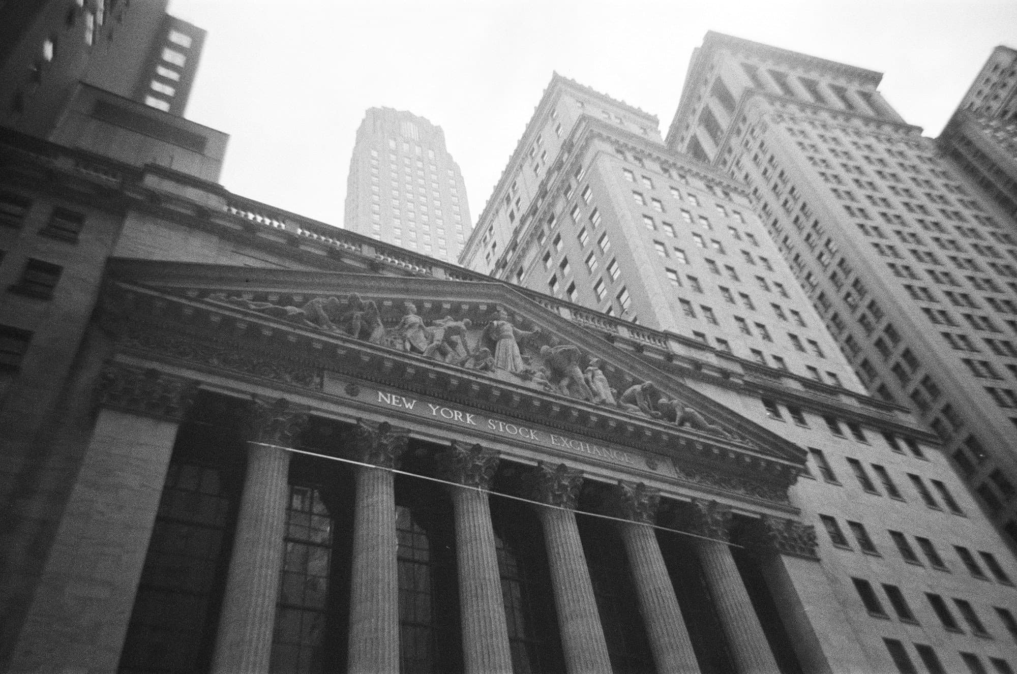 A black and white photo of a building in new york city