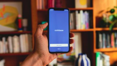 Coinbase Faces Analyst Downgrade as Crypto Volatility Weighs on Stock Valuation cover