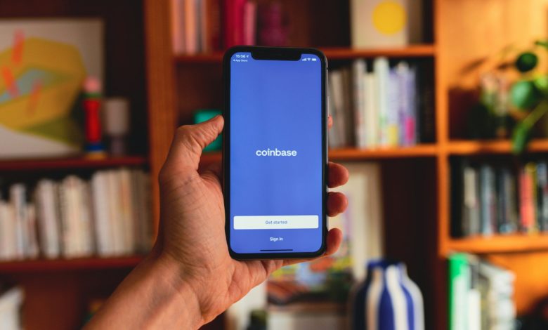 Coinbase Faces Analyst Downgrade as Crypto Volatility Weighs on Stock Valuation cover