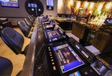 Tabletop games line the bar at Flowing Tide Pub in northwest Las Vegas on Wednesday, Feb. 22, 2023. (Jeff Scheid/The Nevada Independent)
