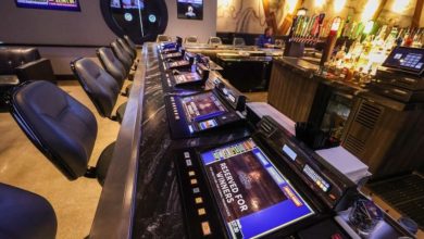 Tabletop games line the bar at Flowing Tide Pub in northwest Las Vegas on Wednesday, Feb. 22, 2023. (Jeff Scheid/The Nevada Independent)