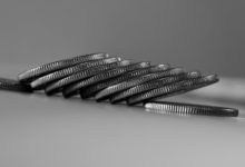 a stack of silver coins sitting on top of a table