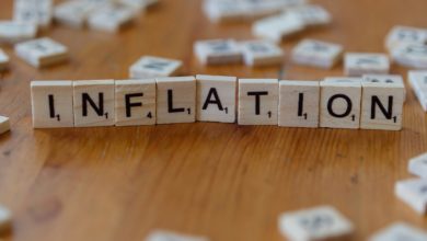 Inflation is spelled out using scrabble tiles.