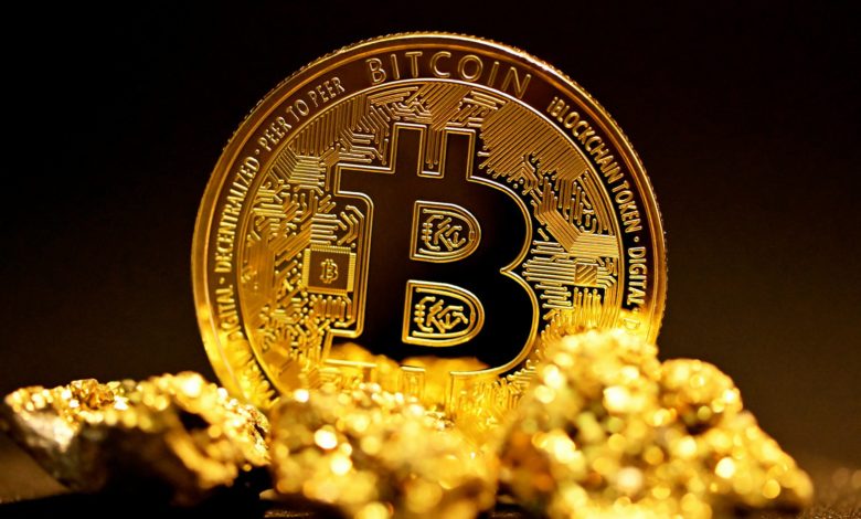a bitcoin sitting on top of a pile of gold nuggets