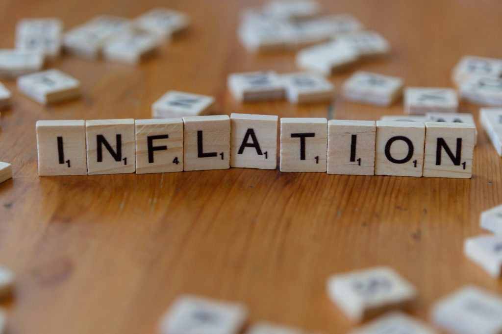 Inflation is spelled out using scrabble tiles.
