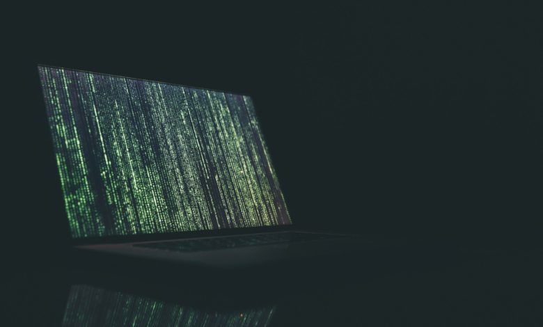 black and gray laptop computer turned on