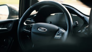 black nissan car steering wheel