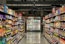 grocery store aisle with stocked shelves