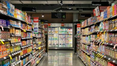 grocery store aisle with stocked shelves