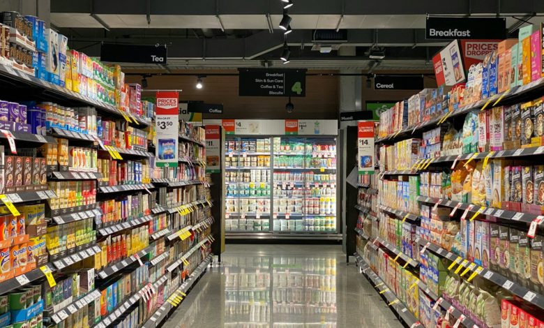 grocery store aisle with stocked shelves