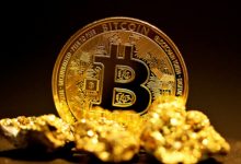 a bitcoin sitting on top of a pile of gold nuggets