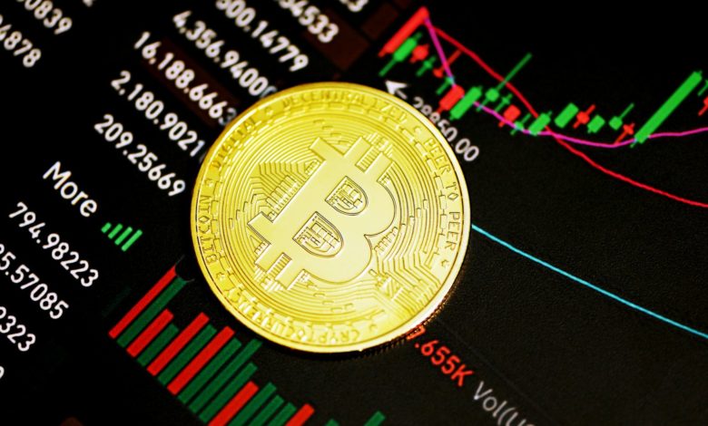 gold round coin on black surface
